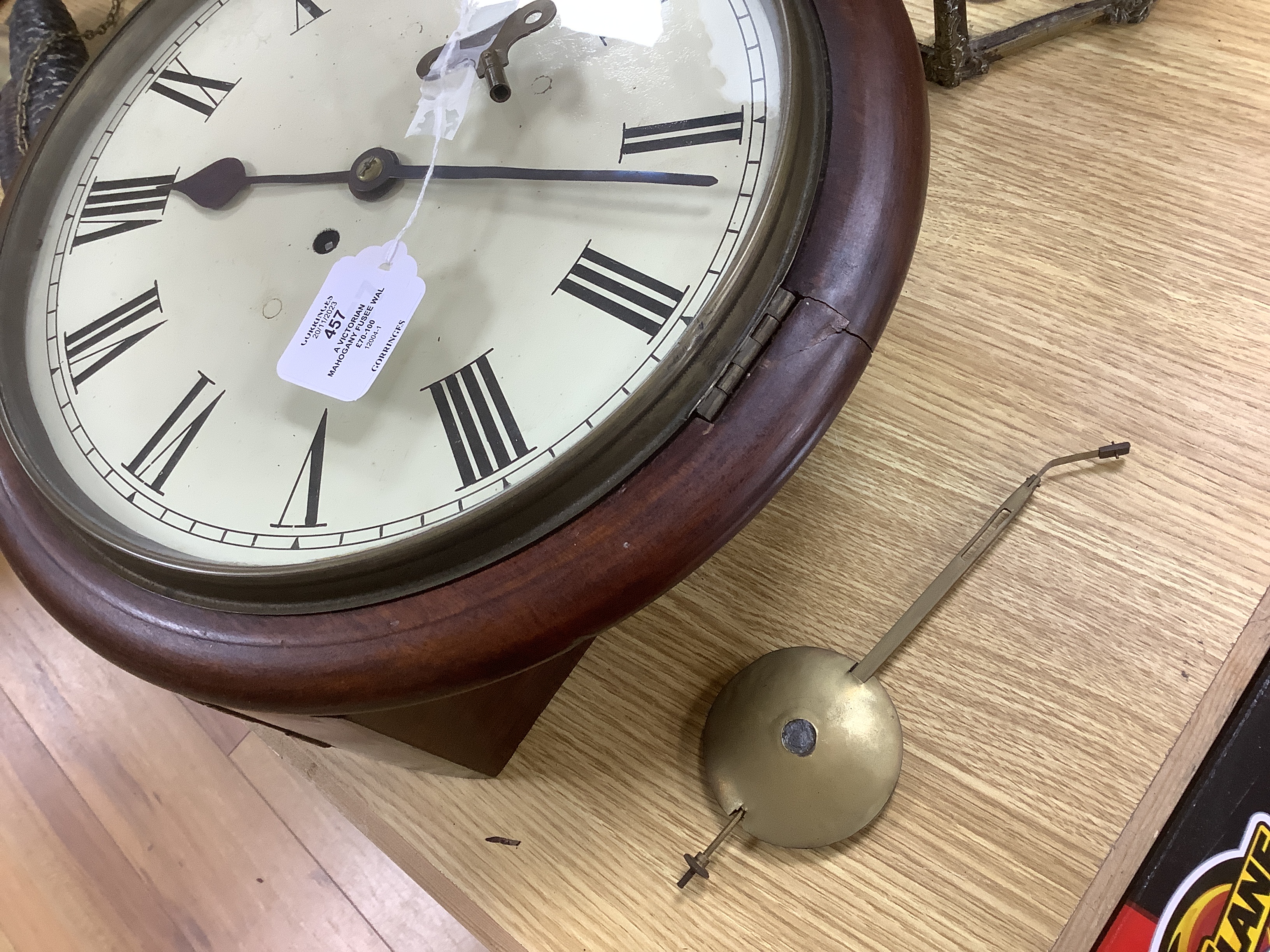 A Victorian mahogany fusee wall clock with pendulum and key, 38cm high